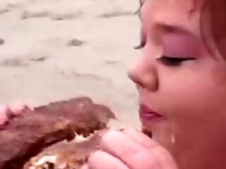 Fat lifeguard bi-otches lick food on the beach