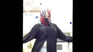 dispirited arab girl dances in abaya